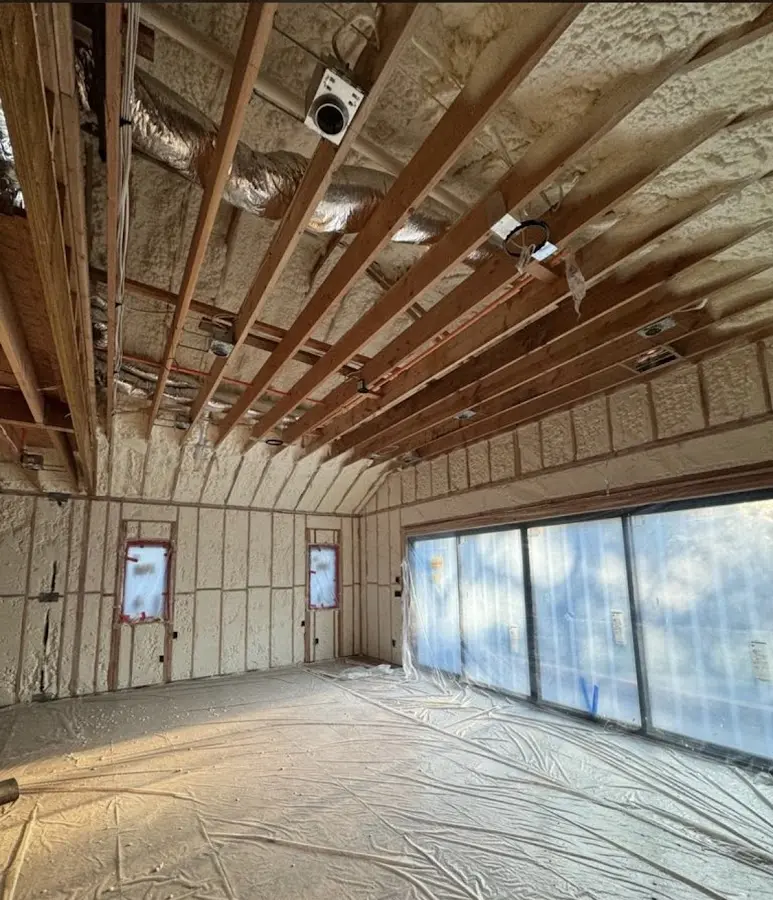 Interior walls and ceiling insulated with spray foam during new construction in Edgewater